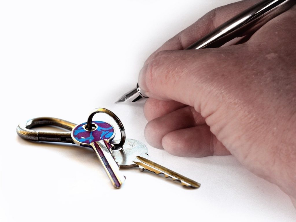 landlord writing and house keys