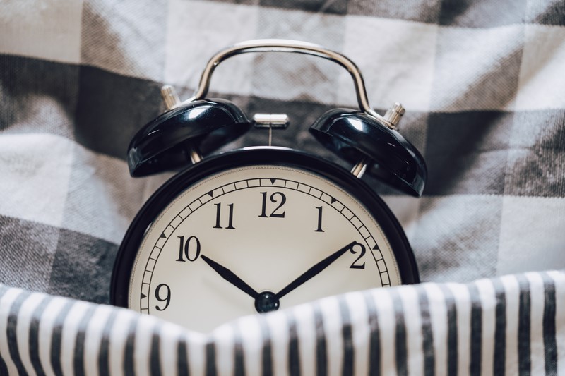 alarm clock reminding someone not to sleep in 